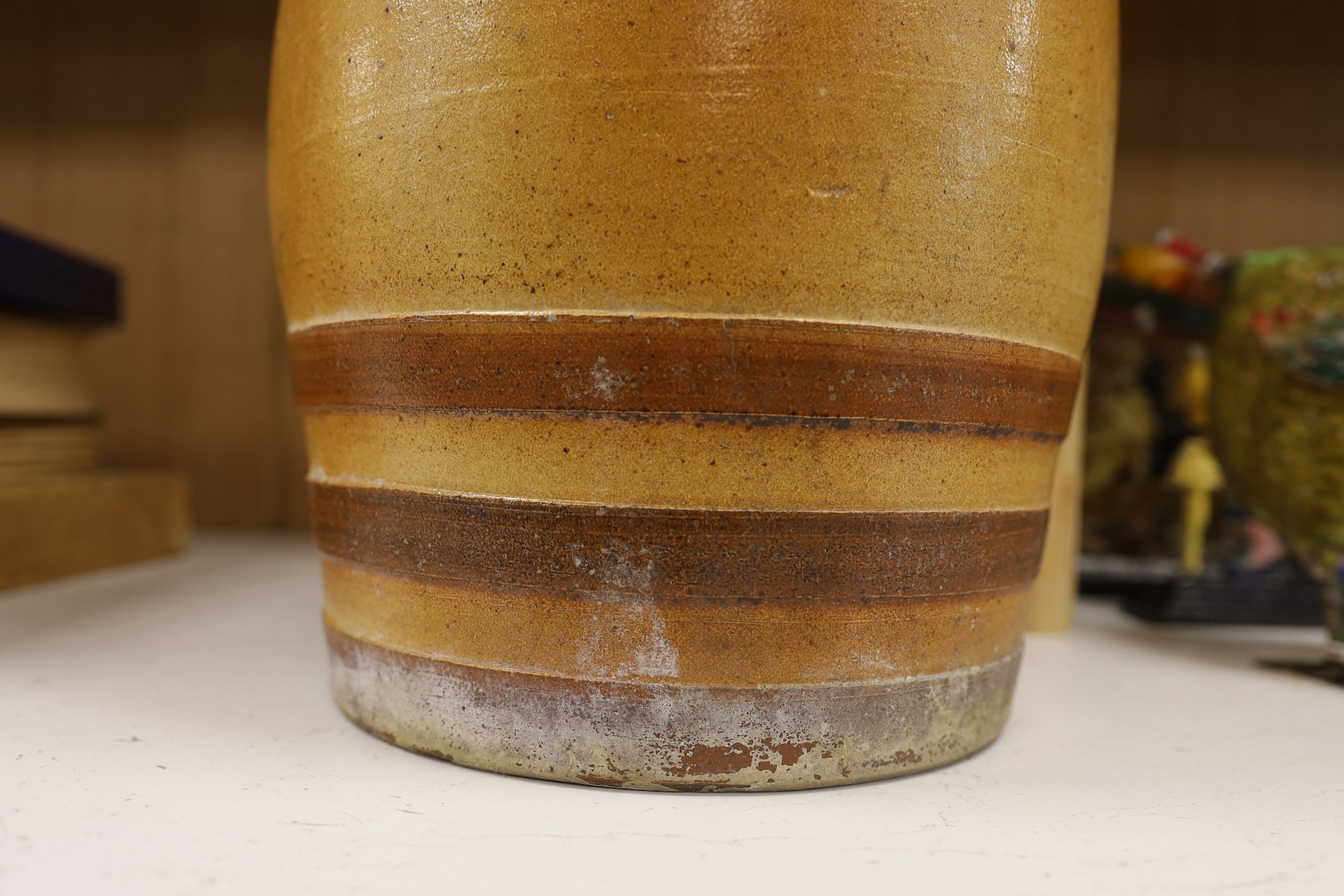 A Doulton and Watts stoneware spirit barrel, applied with the Royal coat of arms, 33.5cm high. Condition - some scratches in the glazing and marks on band by tap aperture